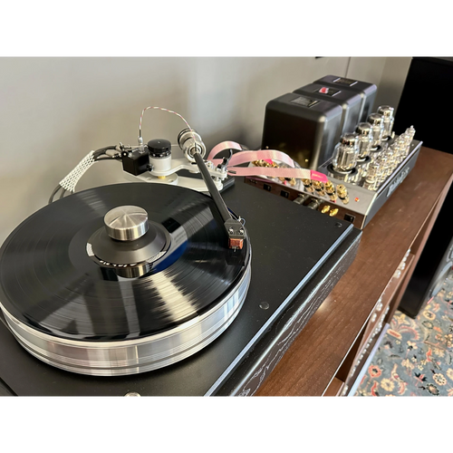 A display featuring an audiophile grade turntable playing a record.