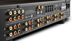 McIntosh CR106 rear angle view highlighting six-zone outputs, digital inputs, Dante networking, and control connections