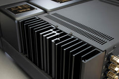Close-up of the McIntosh MAC7200 monogrammed heatsinks and internal chassis