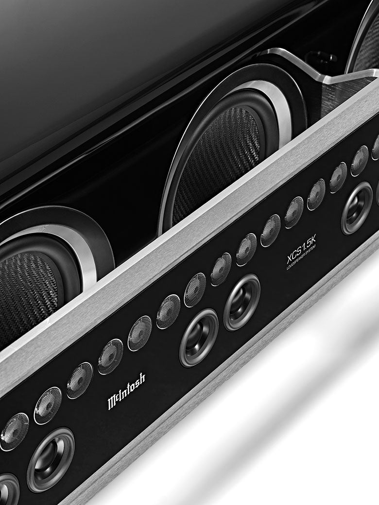 McIntosh XCS1.5K center channel with magnetic grilles removed, showing woofers and line-array drivers
