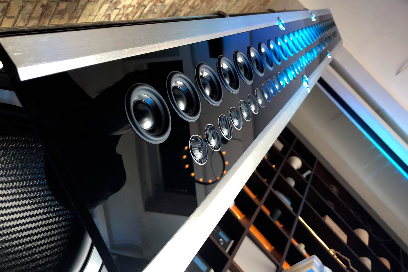 McIntosh XRT2.1K Piano Black cabinet, suspended line array, and aluminum base detail
