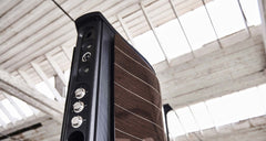 Sonus Faber Aida floorstanding speaker, angled rear view showing the sculpted cabinet