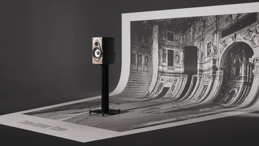 Sonus faber Olympica I G3 bookshelf speaker on its stand beside architectural artwork