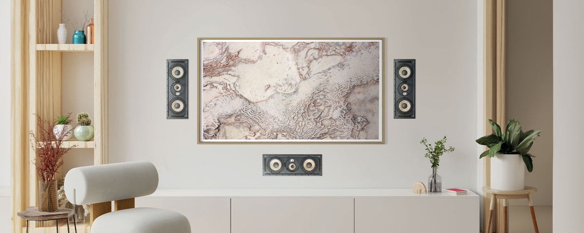 Modern living room with a map on the wall, speakers, and decorative items.