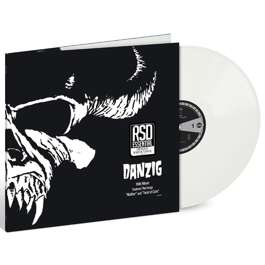 Vinyl record with black and white cover featuring a creature's face, labeled 'Danzig' on a white background.