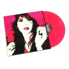 Vinyl record with a stylized cover of a woman's face and a pink disc.