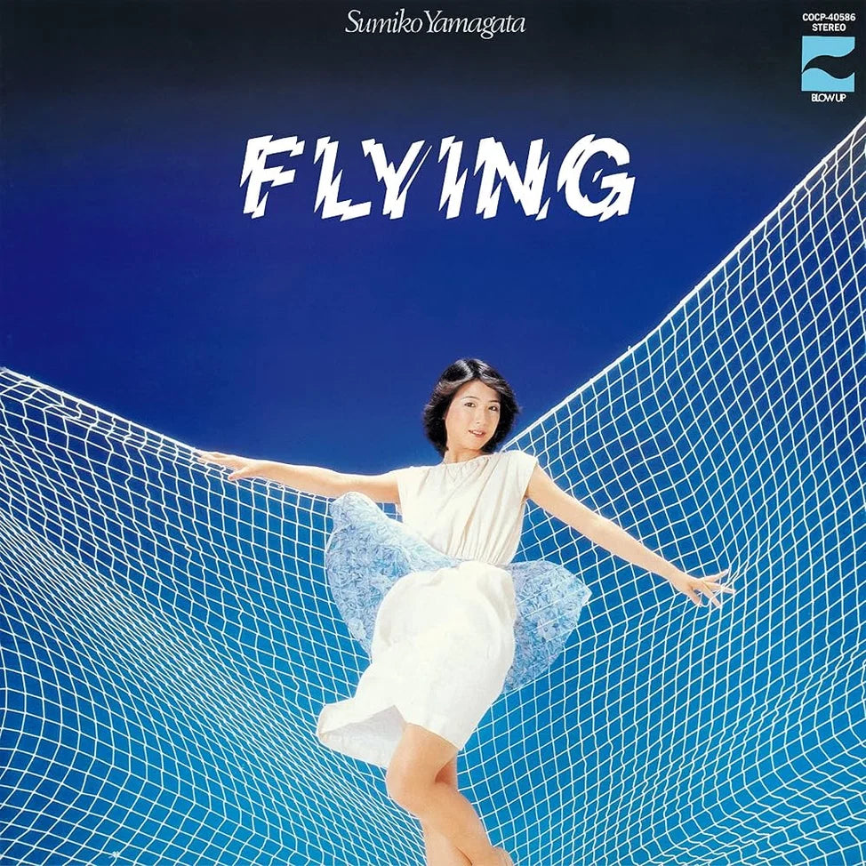 Album cover for 'FLYING' by Sumiko Yamagata, featuring a woman in a white dress suspended in a blue net against a deep blue gradient background.