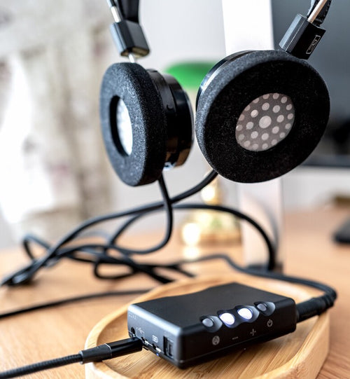 Image shows a portable headphone amp.