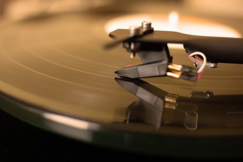 Image is of a turntable cartridge in action.